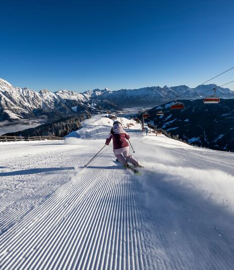 Skiier in action on the slopes in Leogang